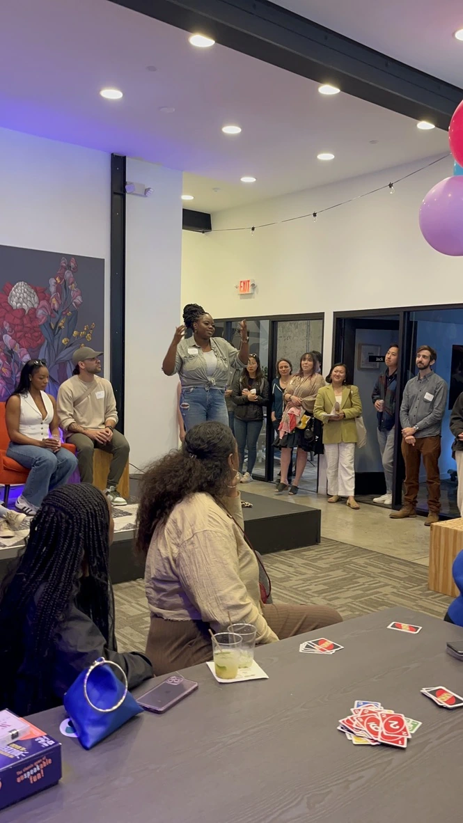 Eniola speaking at a UX Outloud community event