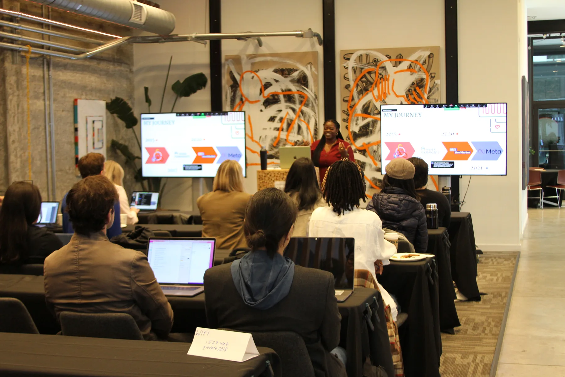 Eniola leading a UX research training workshop